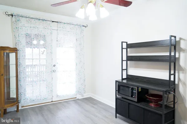 a view of room with wooden floor