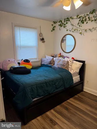 a bedroom with bed and window