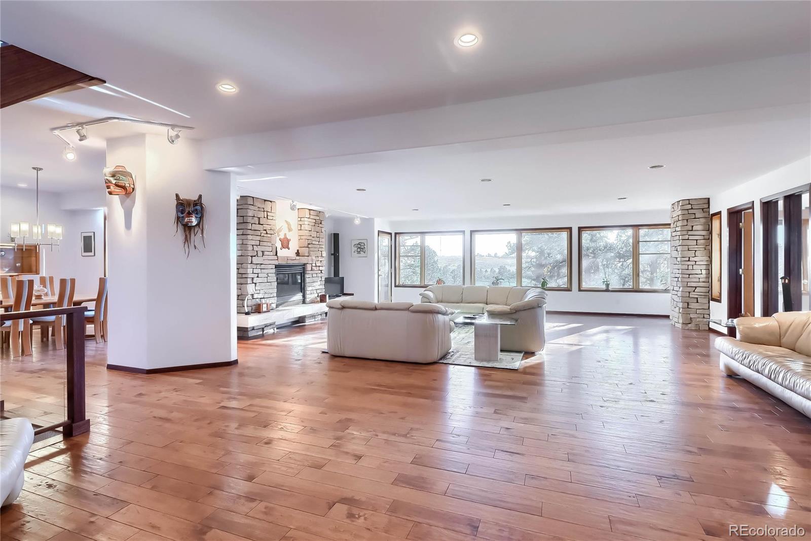 40273 County Road 13 Elizabeth, CO 80107 - Photo 25 of 40 a view of a living room and floor to ceiling window with wooden floor
