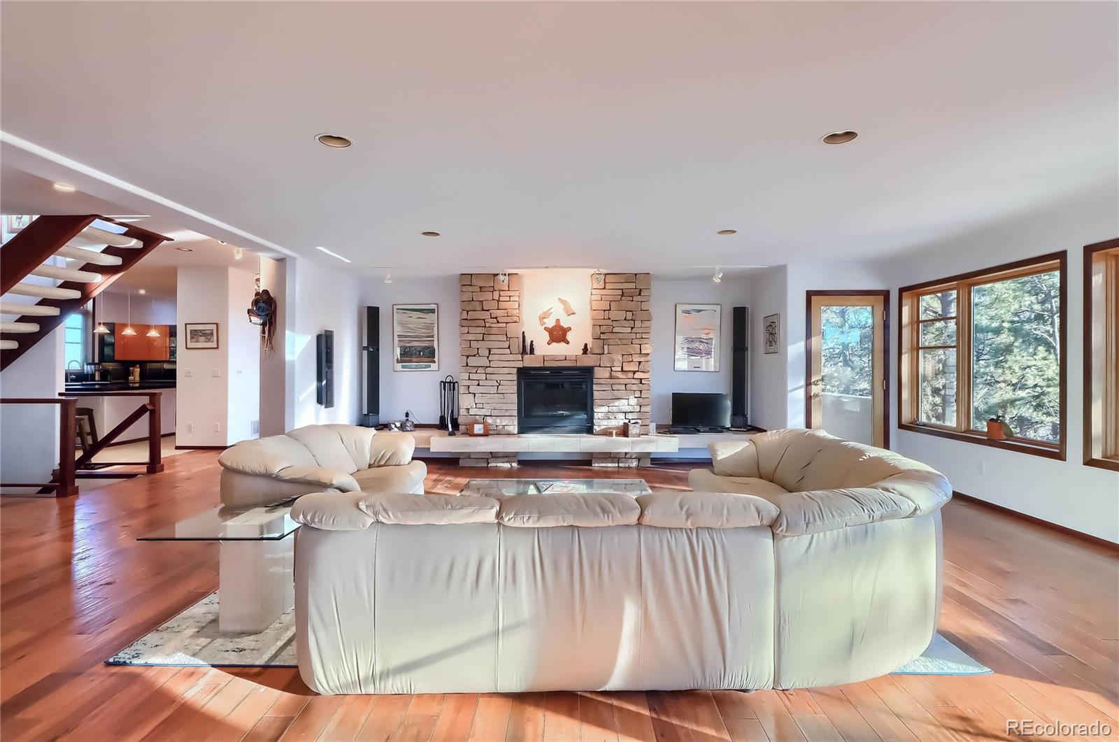 40273 County Road 13 Elizabeth, CO 80107 - Photo 26 of 40 a living room with fireplace furniture and a fireplace
