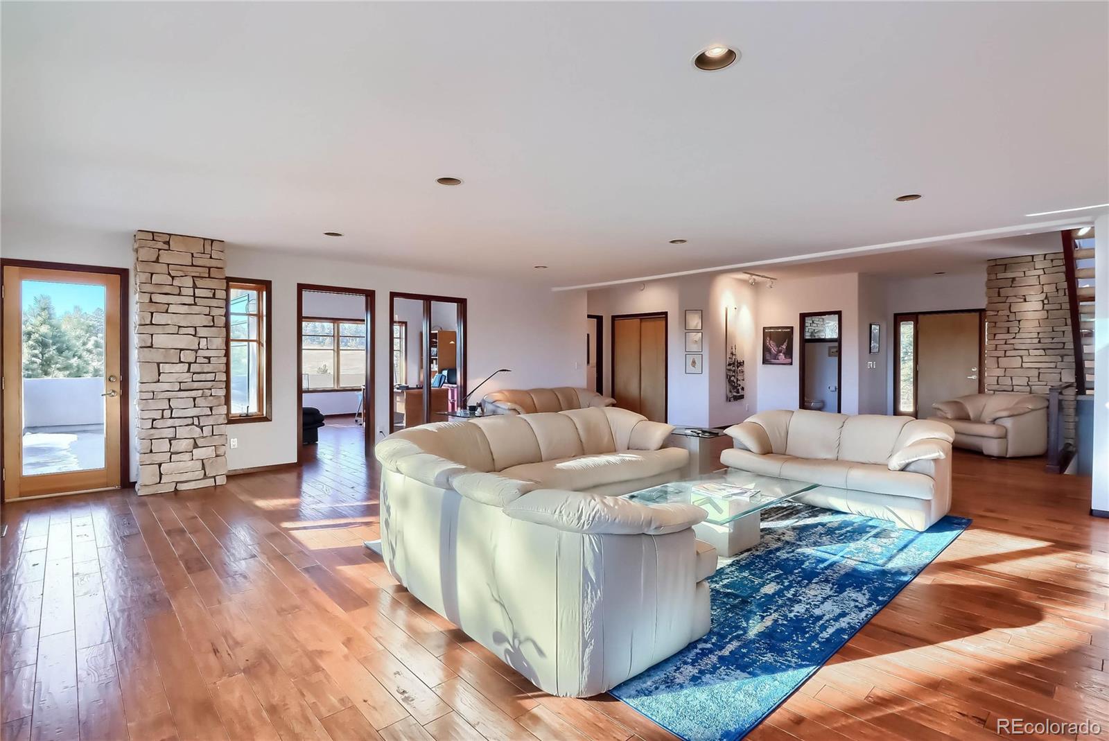 40273 County Road 13 Elizabeth, CO 80107 - Photo 27 of 40 a living room with furniture and a wooden floor