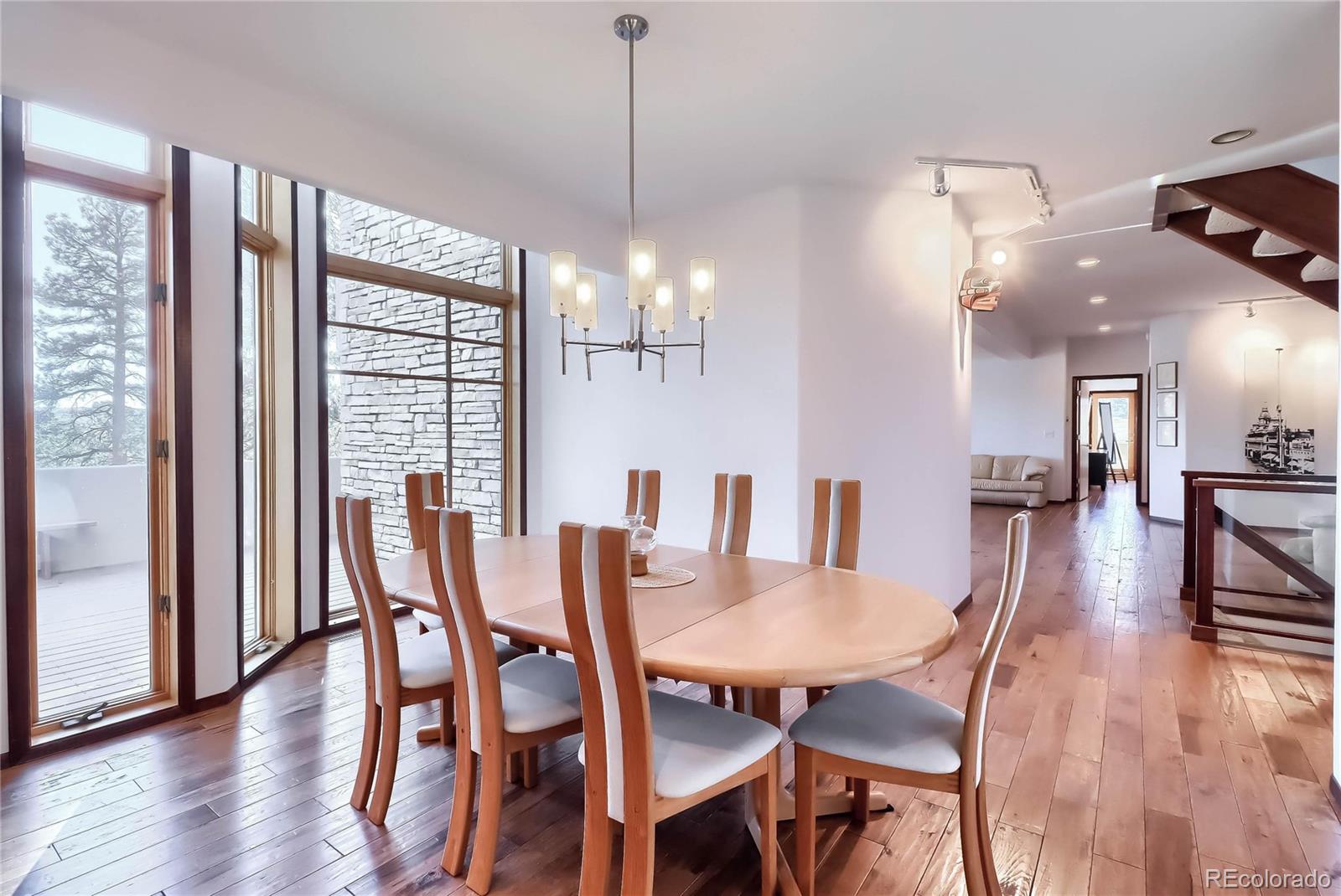 40273 County Road 13 Elizabeth, CO 80107 - Photo 30 of 40 a view of a dining room with furniture and wooden floor