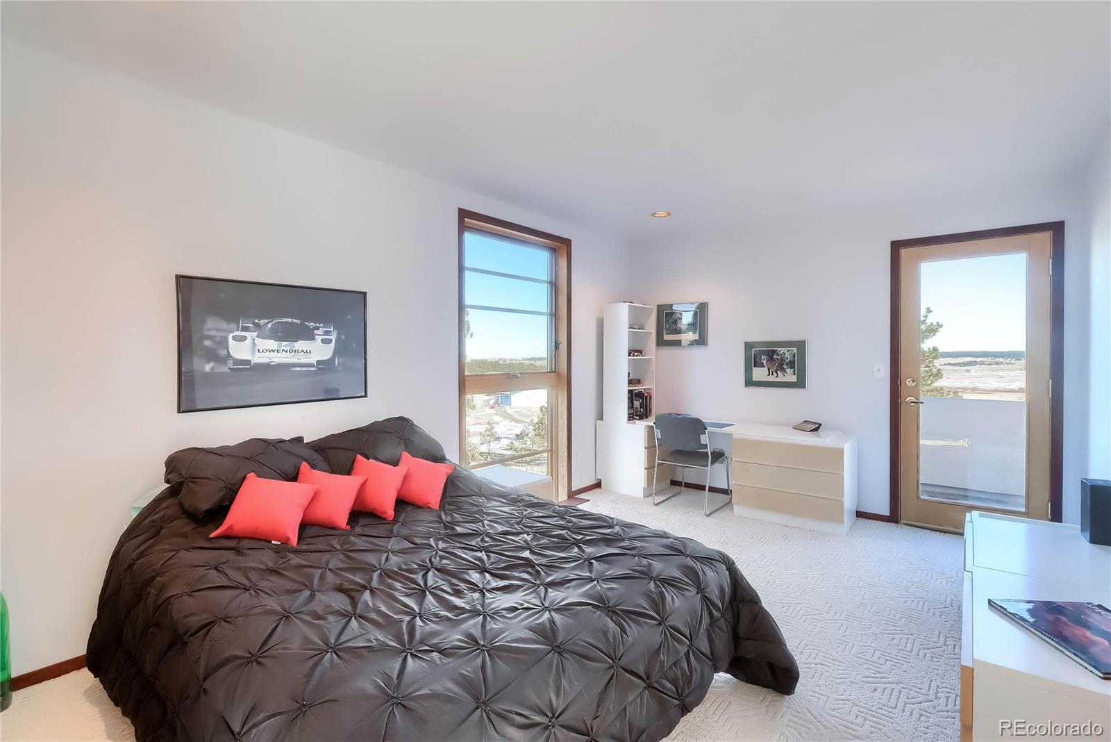 40273 County Road 13 Elizabeth, CO 80107 - Photo 36 of 40 a bedroom with a large bed and a large window