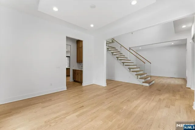 a view of an empty room with stairs