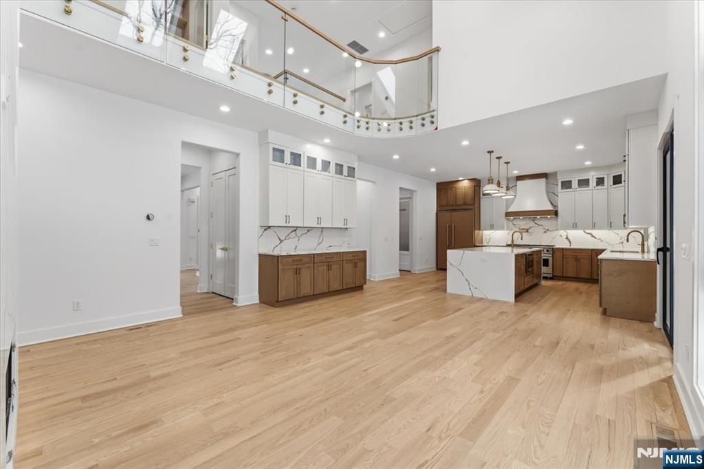 83 Falcon Road Livingston, NJ 07039 - Photo 21 of 34 a large white kitchen with a large window