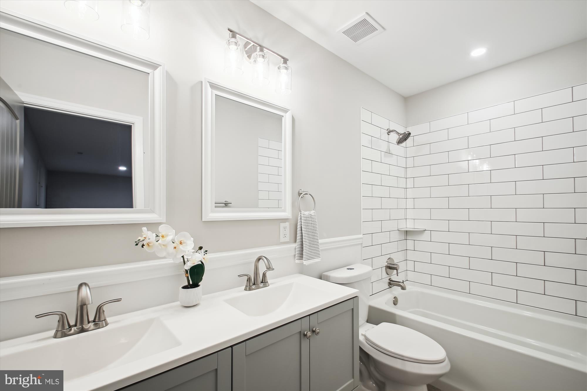 106 Charles Road Linthicum Heights, MD 21090 - Photo 29 of 44 a bathroom with a sink a toilet and shower