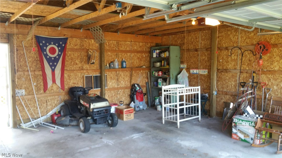 6308 Wayland Road Ravenna, OH 44266 - Photo 17 of 22 Interior view of 2 car garage with 2 remote overhead door openers, and walk-in door on back side, concrete floor.