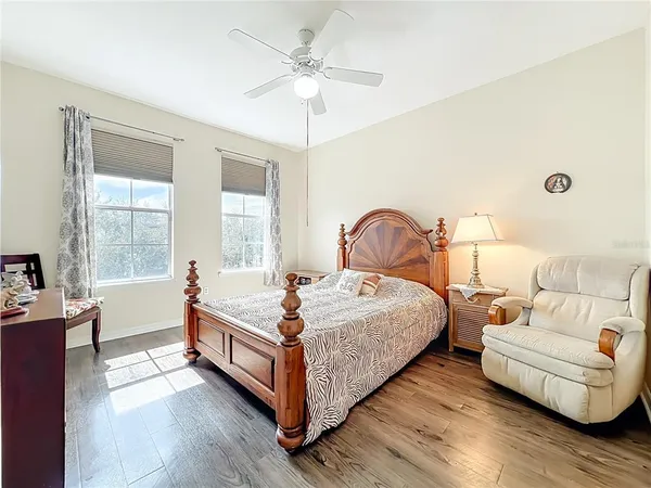 a bedroom with bed and window