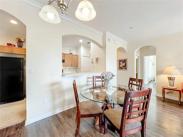 a view of a dining room with furniture and wooden floor