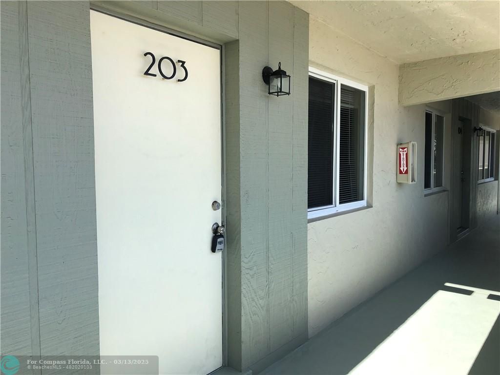 1400 Northeast 54th Street, Unit 203 Fort Lauderdale, FL 33334 - Photo 1 of 19 a view of a hallway