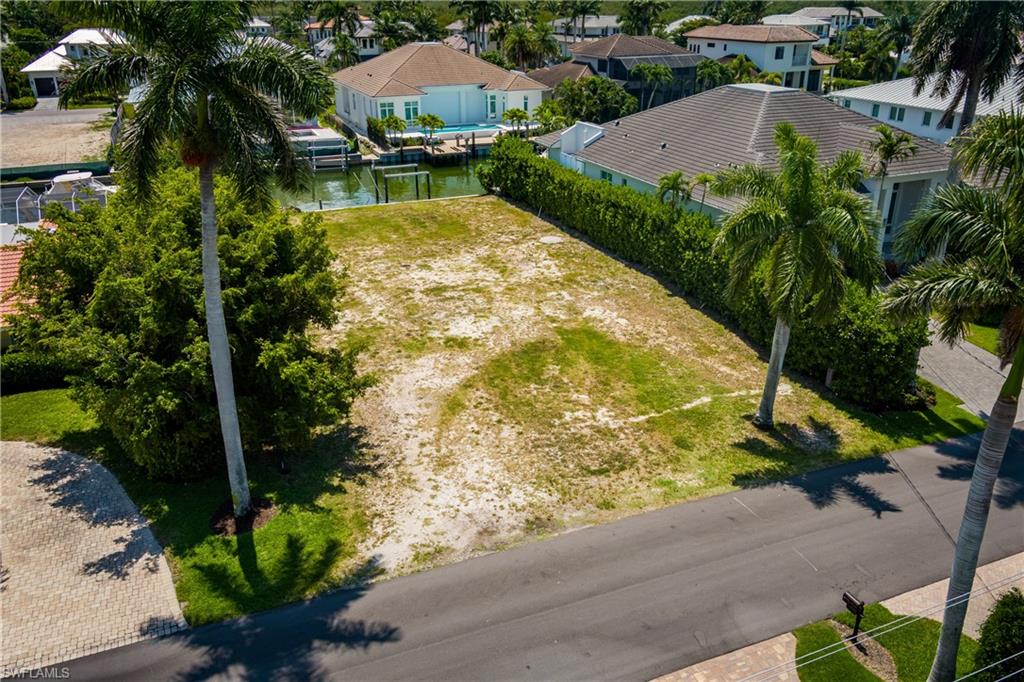 2165 Tarpon Road Naples, FL 34102 - Photo 9 of 24 a view of a garden with a fountain