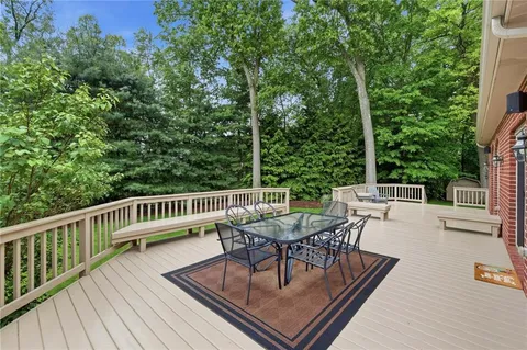 a view of roof deck with patio