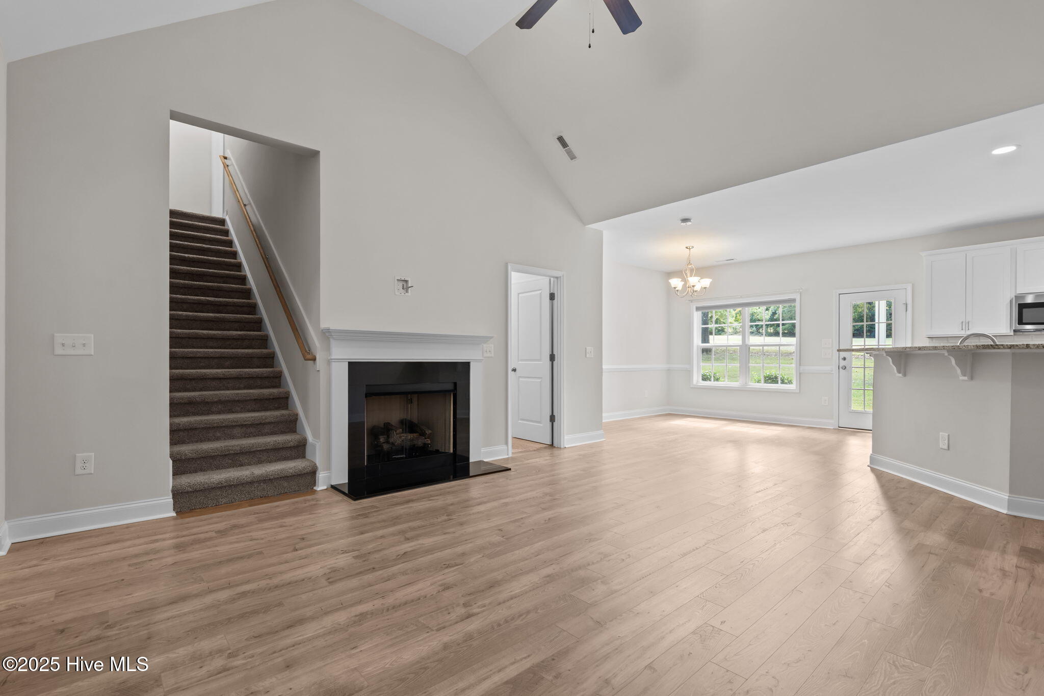21 Ridge Road Jackson Springs, NC 27281 - Photo 13 of 49 living room with stairs to bonus/4th bdr
