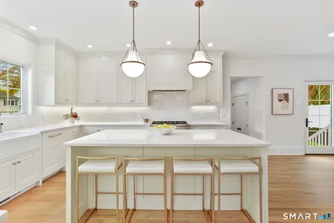 a kitchen with a table and chairs in it