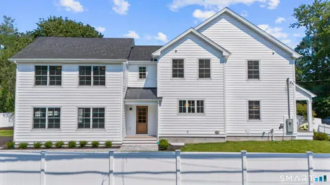 a view of front of house with a yard