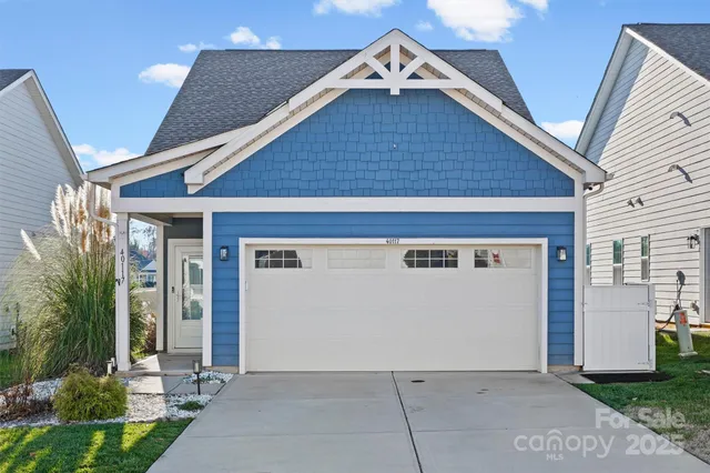 a view of house with garage