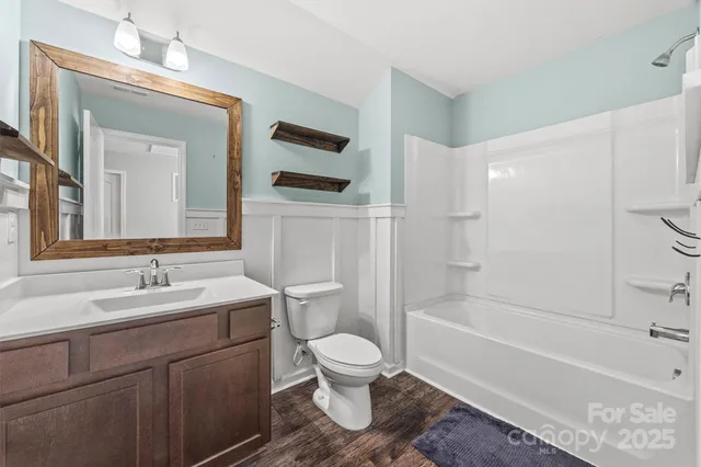 a bathroom with a toilet a sink and a bathtub