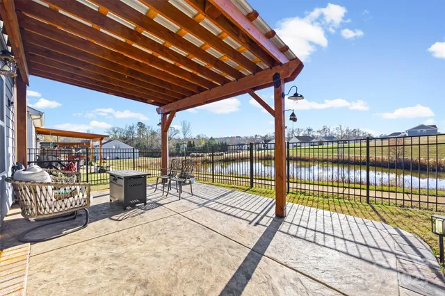 a view of a swimming pool with a patio