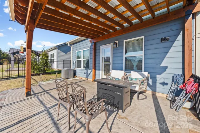 a building outdoor space with patio furniture and potted plants