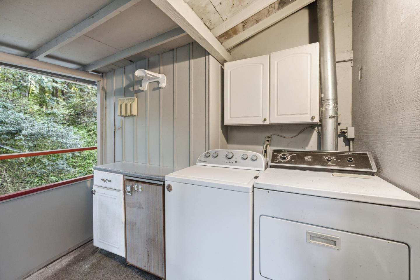 495 Primavera Road Boulder Creek, CA 95006 - Photo 13 of 36 a view of storage and utility room with washer and dryer