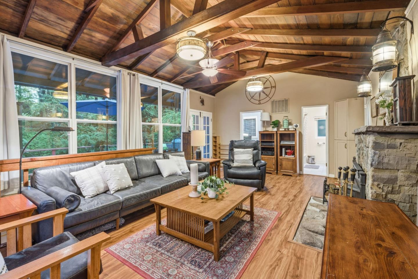 495 Primavera Road Boulder Creek, CA 95006 - Photo 2 of 36 a living room with furniture and a large window