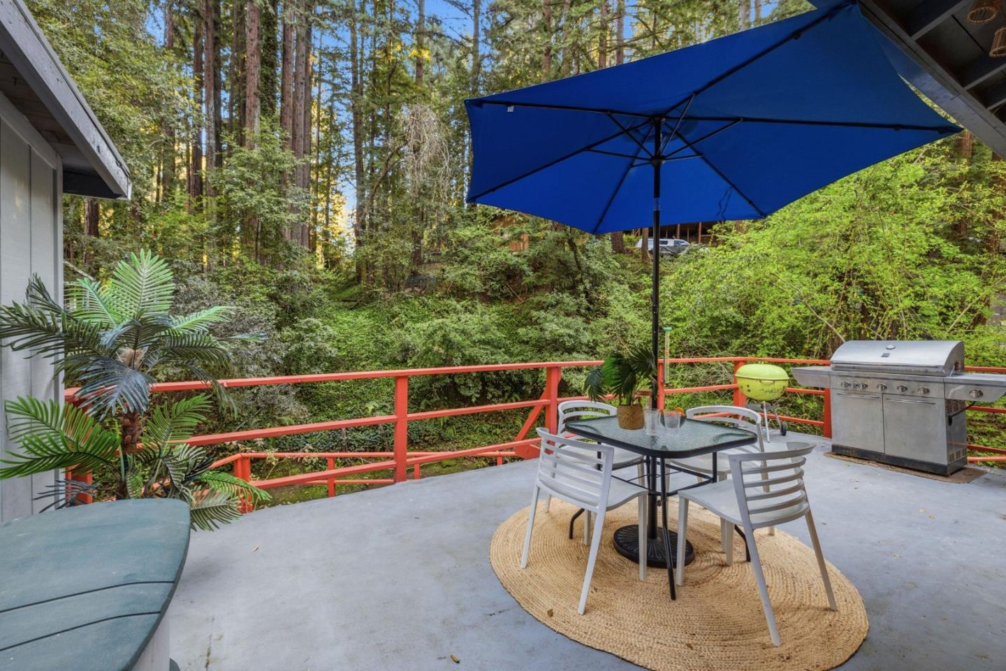 495 Primavera Road Boulder Creek, CA 95006 - Photo 8 of 36 a view of a chairs and table in the patio