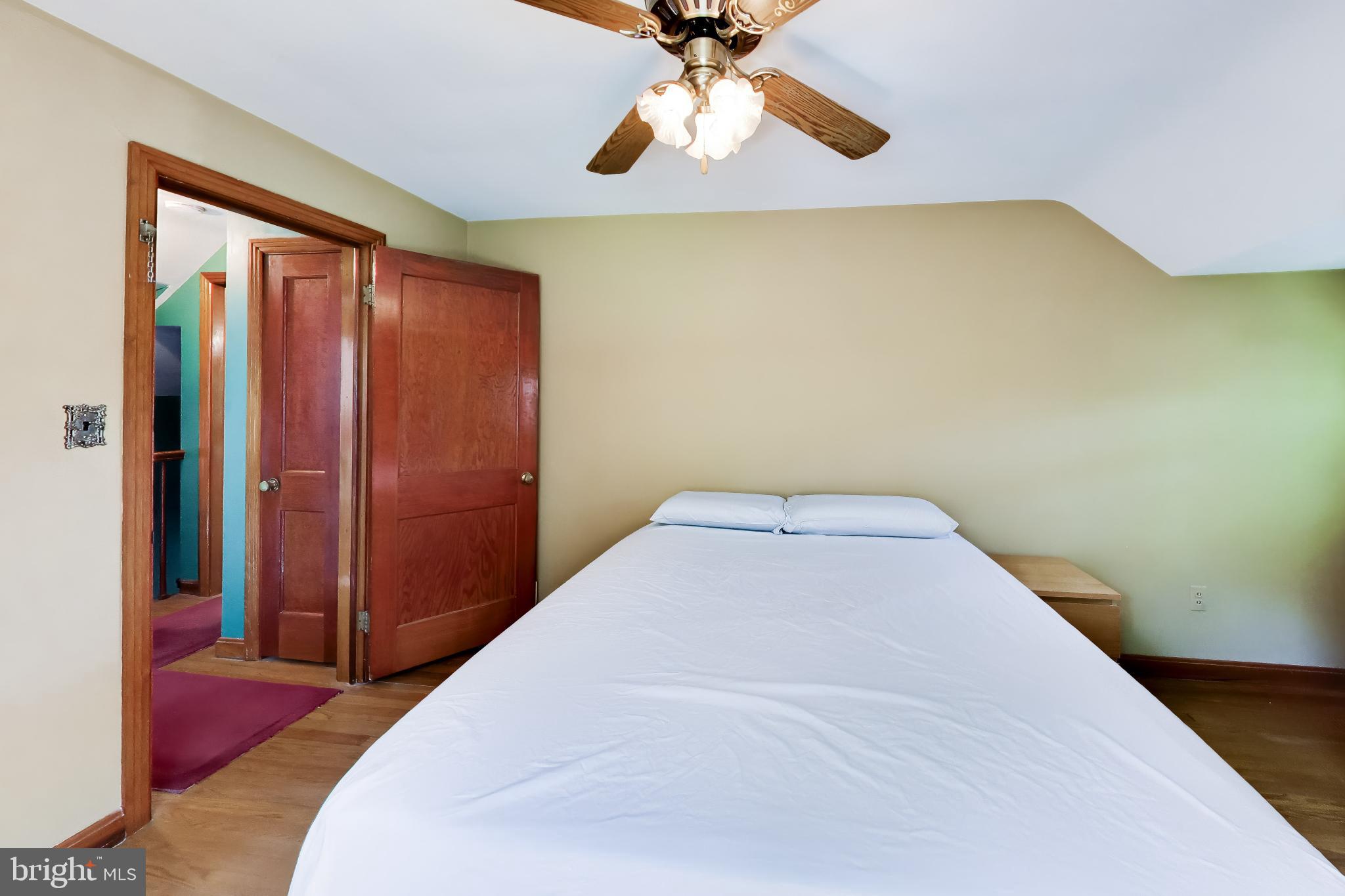 5707 Greenleaf Road Cheverly, MD 20743 - Photo 18 of 40 Cozy bedroom with warm wooden accents.