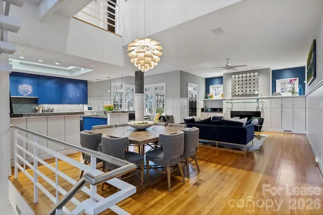 a living room with a couch a dining table and kitchen view
