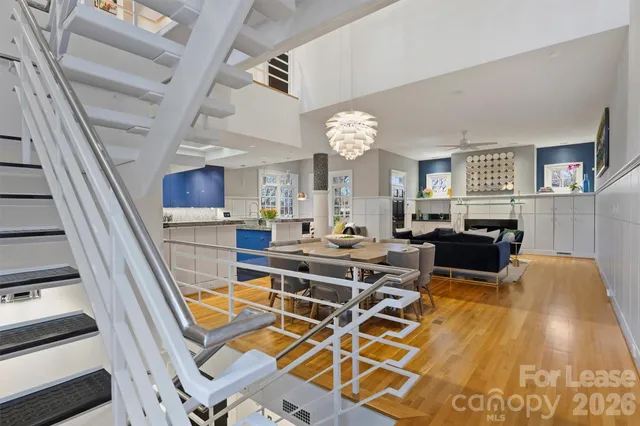 a living room with lots of furniture and a clock