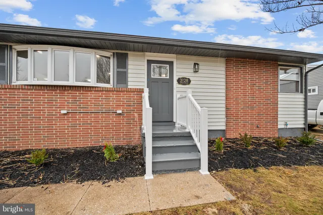 a front view of a house with stairs