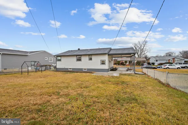 a swimming pool with yard and outdoor seating
