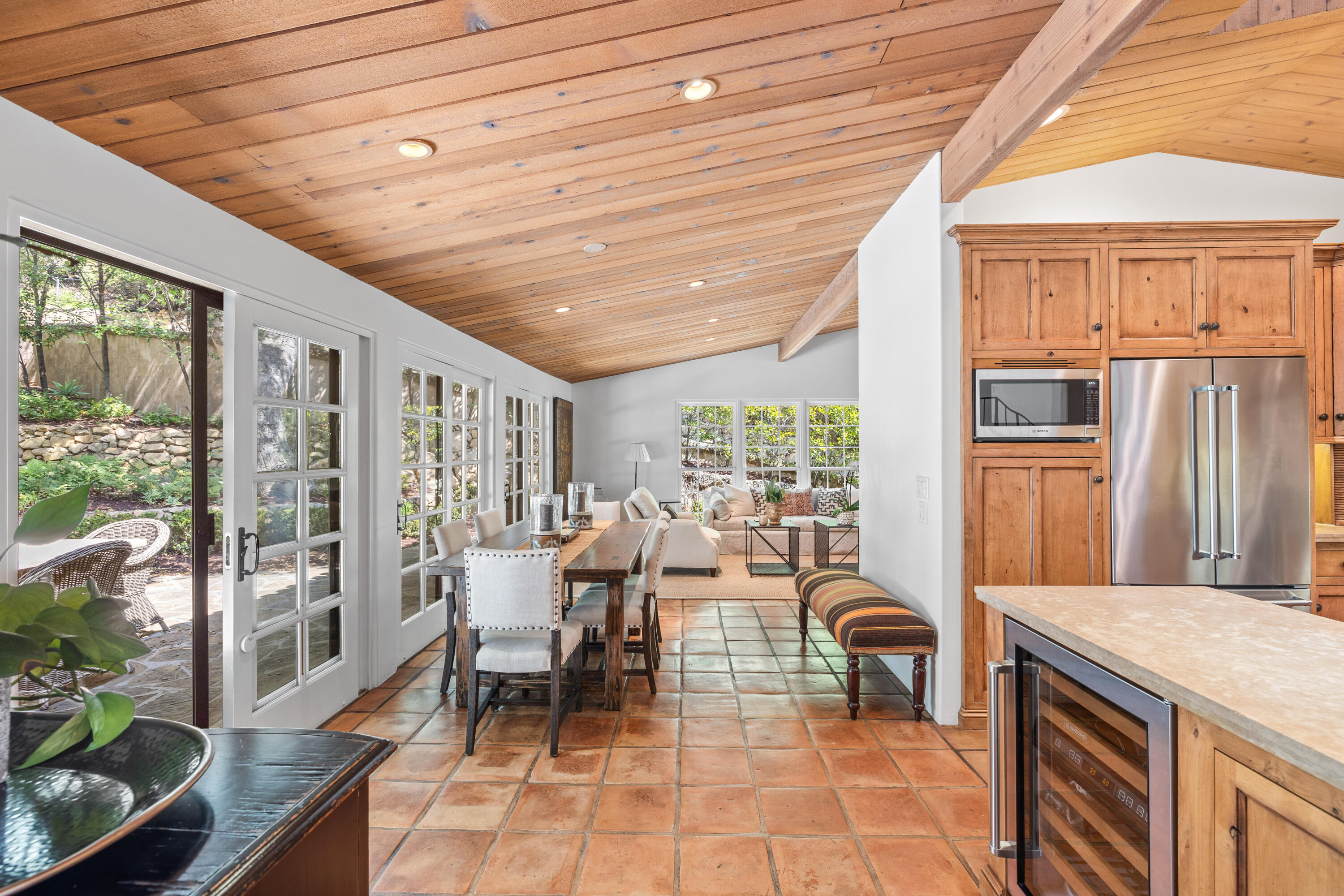 853 Jimeno Road Santa Barbara, CA 93103 - Photo 12 of 27 a living room with furniture a large window and a table