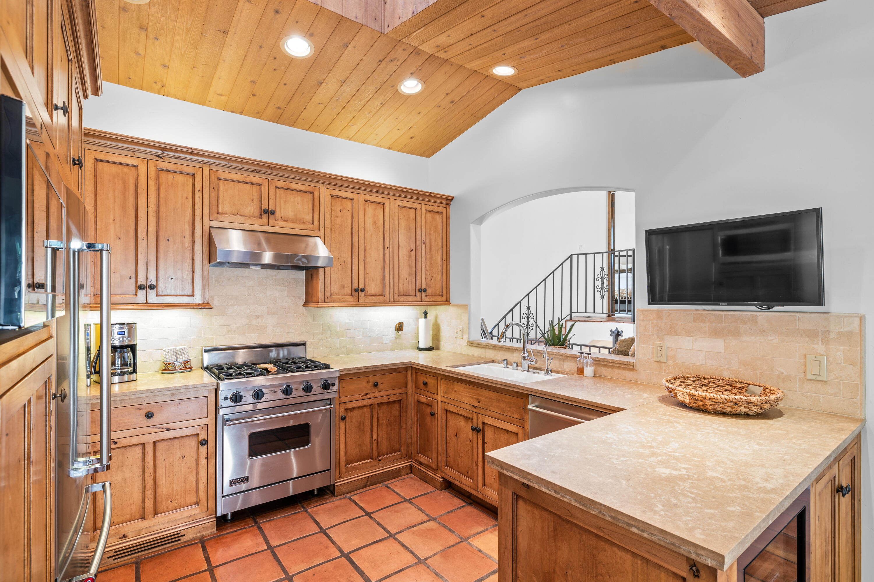 853 Jimeno Road Santa Barbara, CA 93103 - Photo 14 of 27 a kitchen with a sink stove top oven and cabinets