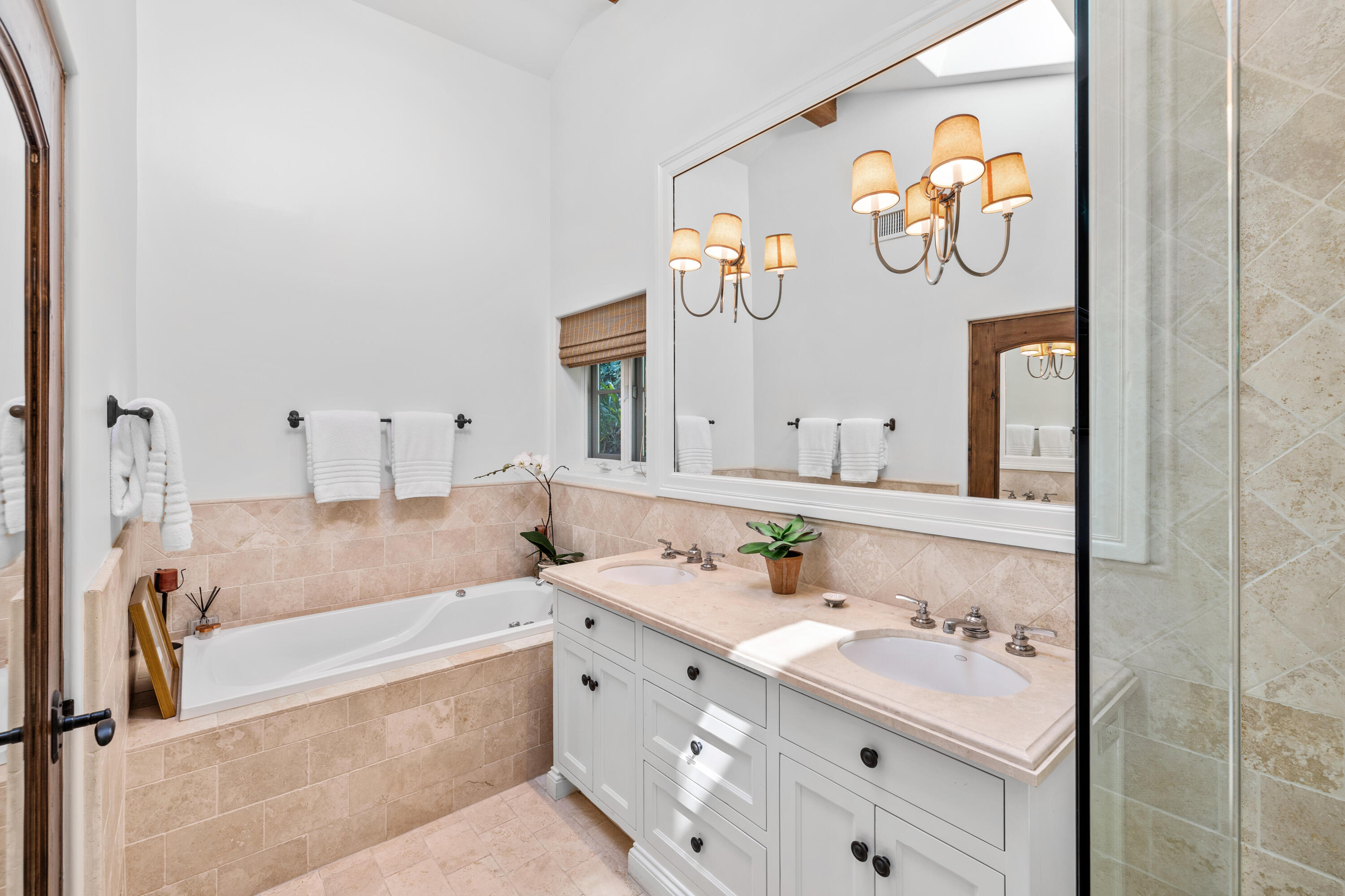 853 Jimeno Road Santa Barbara, CA 93103 - Photo 19 of 27 a bathroom with a bathtub and a sink
