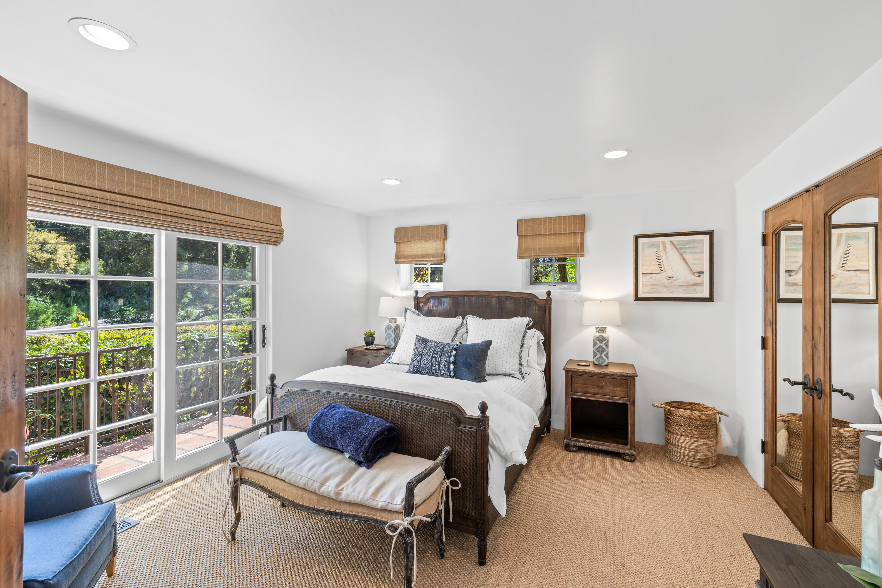 853 Jimeno Road Santa Barbara, CA 93103 - Photo 20 of 27 a bedroom with furniture and a large window