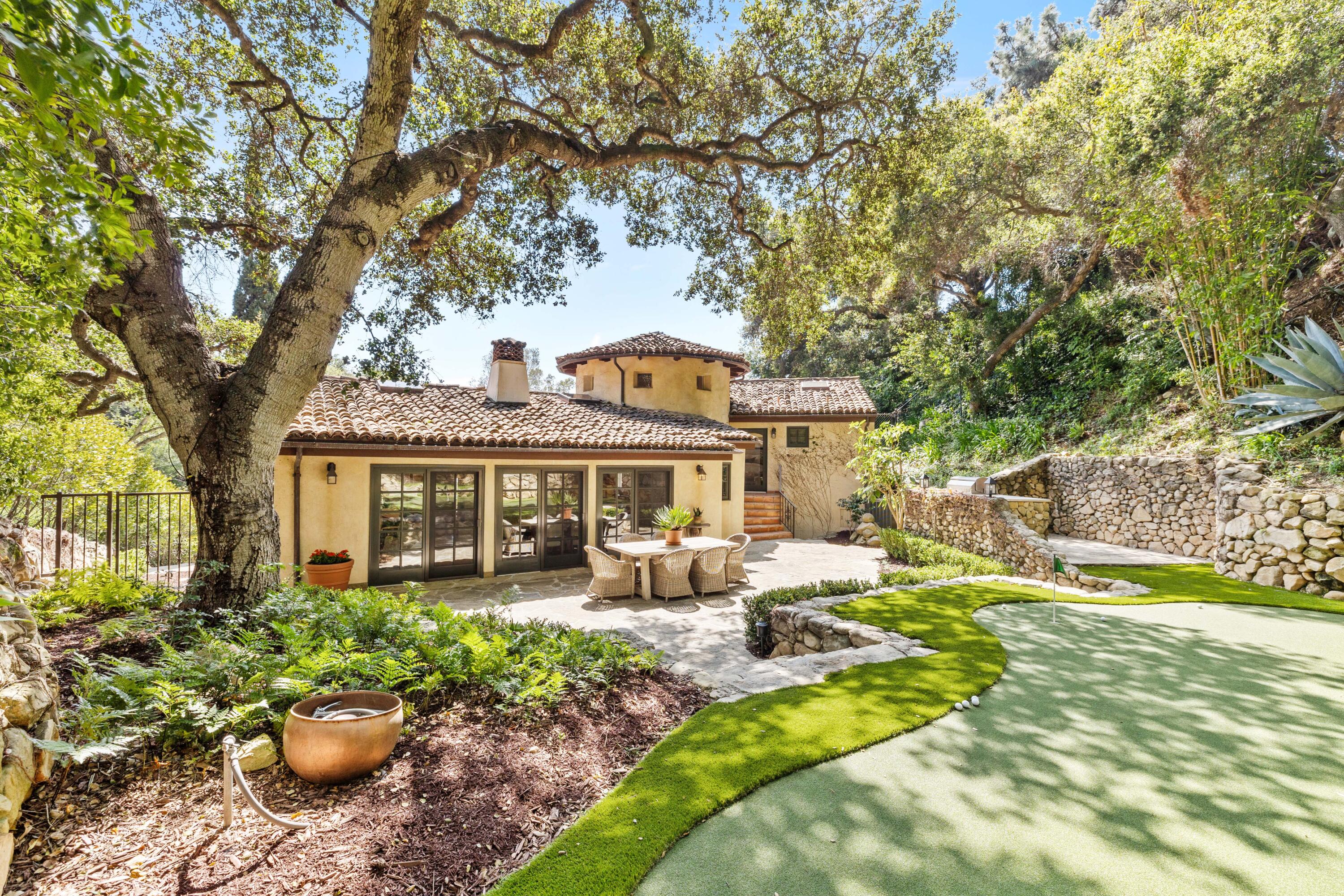 853 Jimeno Road Santa Barbara, CA 93103 - Photo 2 of 27 a front view of a house with a yard patio and fire pit