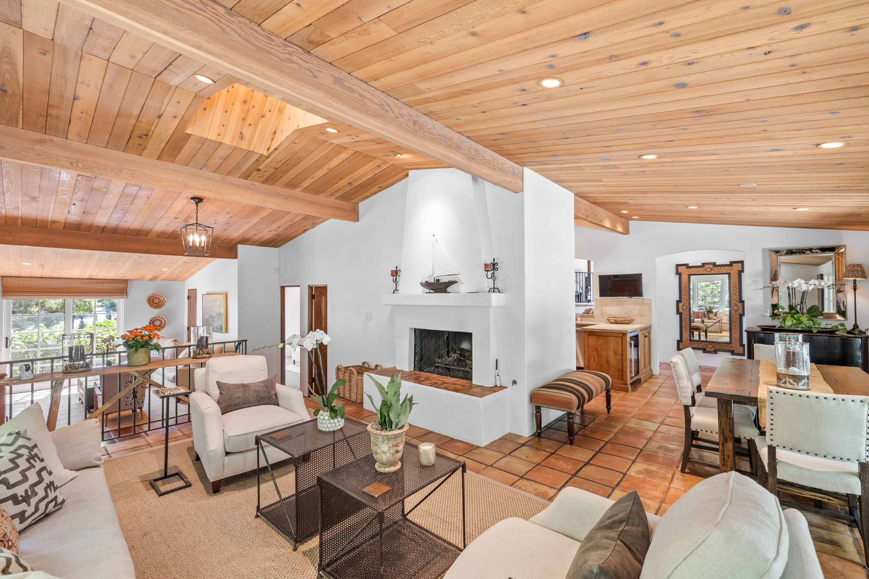 853 Jimeno Road Santa Barbara, CA 93103 - Photo 10 of 27 a living room with furniture a fireplace and a table