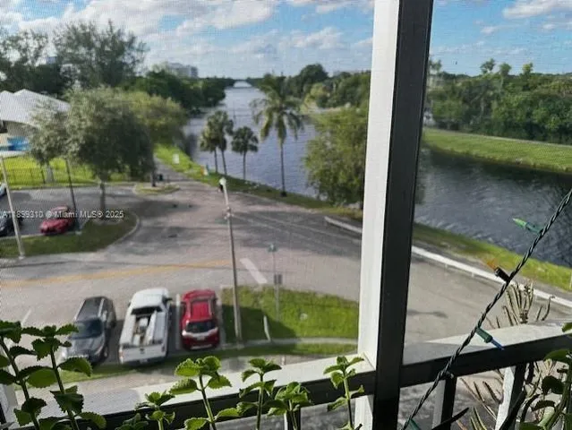 a view of a street with sitting area