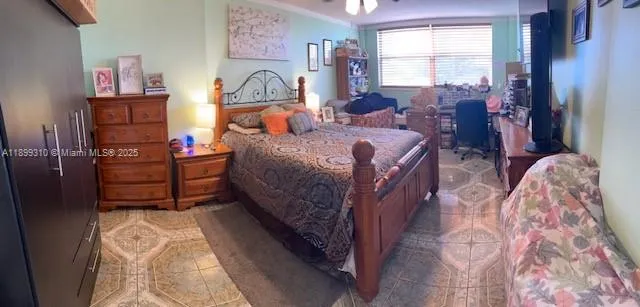 a bed room with a bed window and a dresser