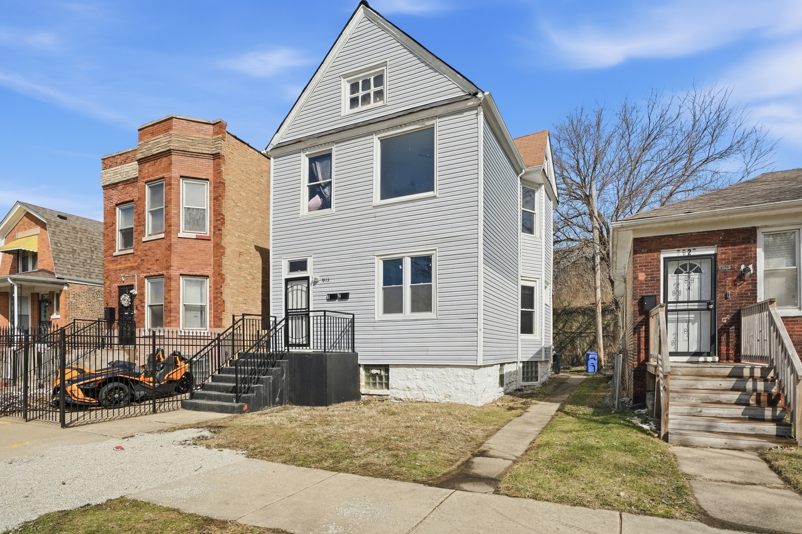 7923 South Lowe Avenue Chicago, IL 60620 - Photo 2 of 23 a front view of a house with yard