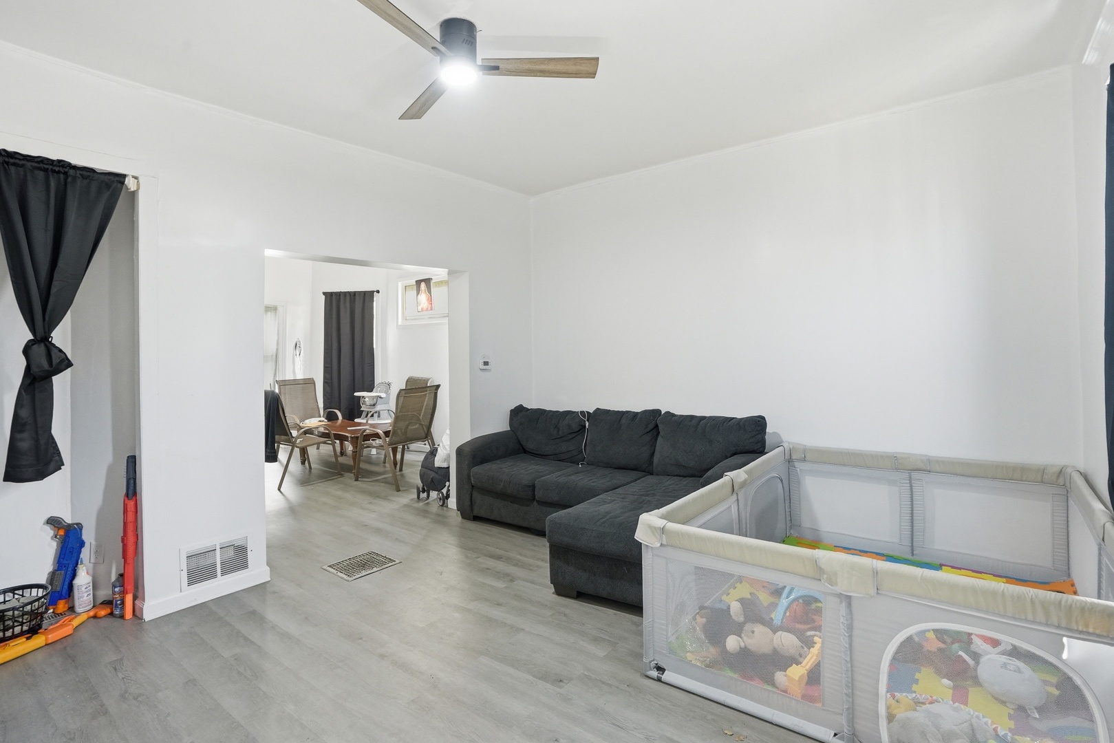 7923 South Lowe Avenue Chicago, IL 60620 - Photo 10 of 23 a living room with furniture and a flat screen tv