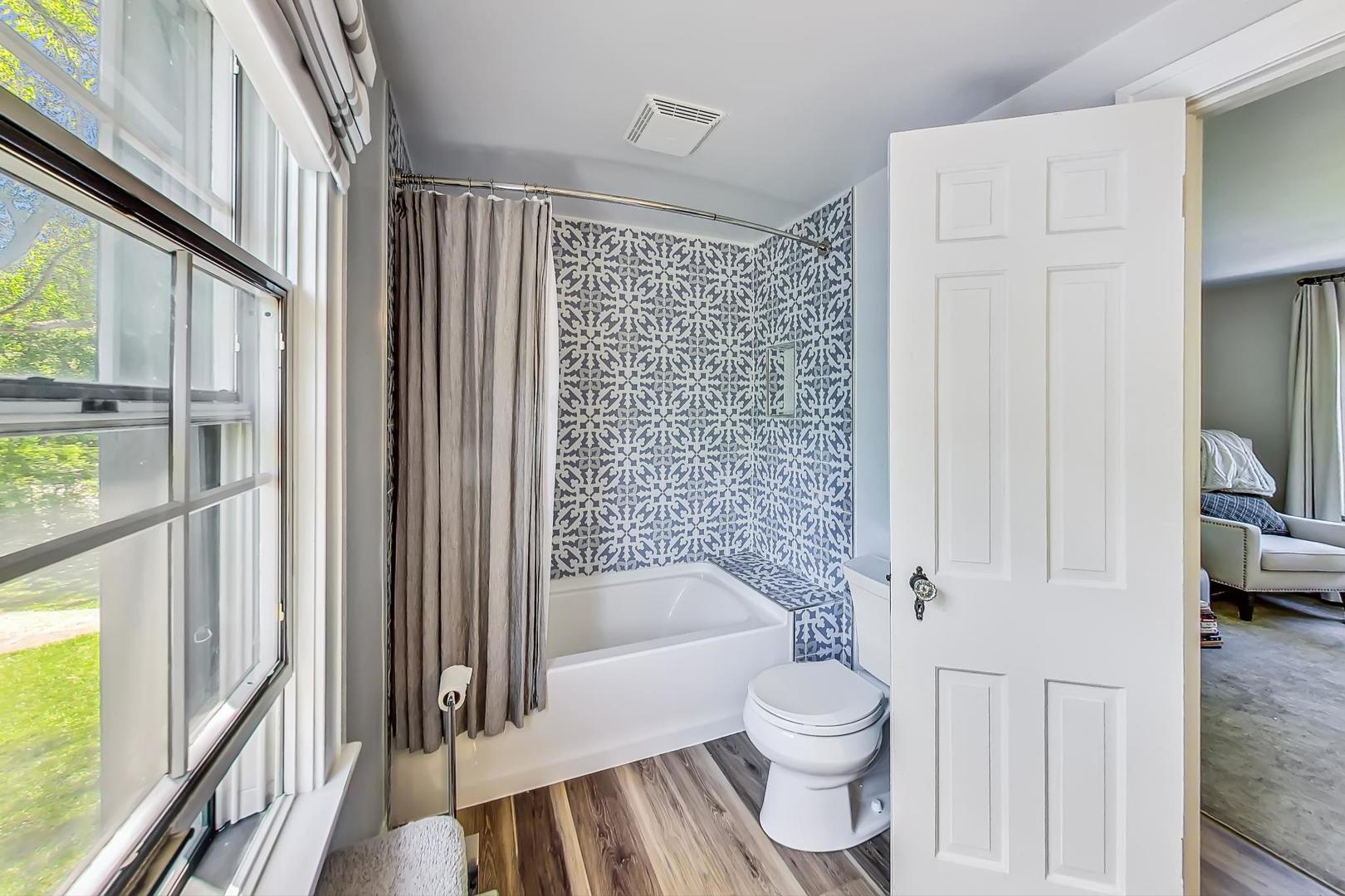 12 Timber Lane Northbrook, IL 60062 - Photo 17 of 28 a bathroom with a toilet and a shower