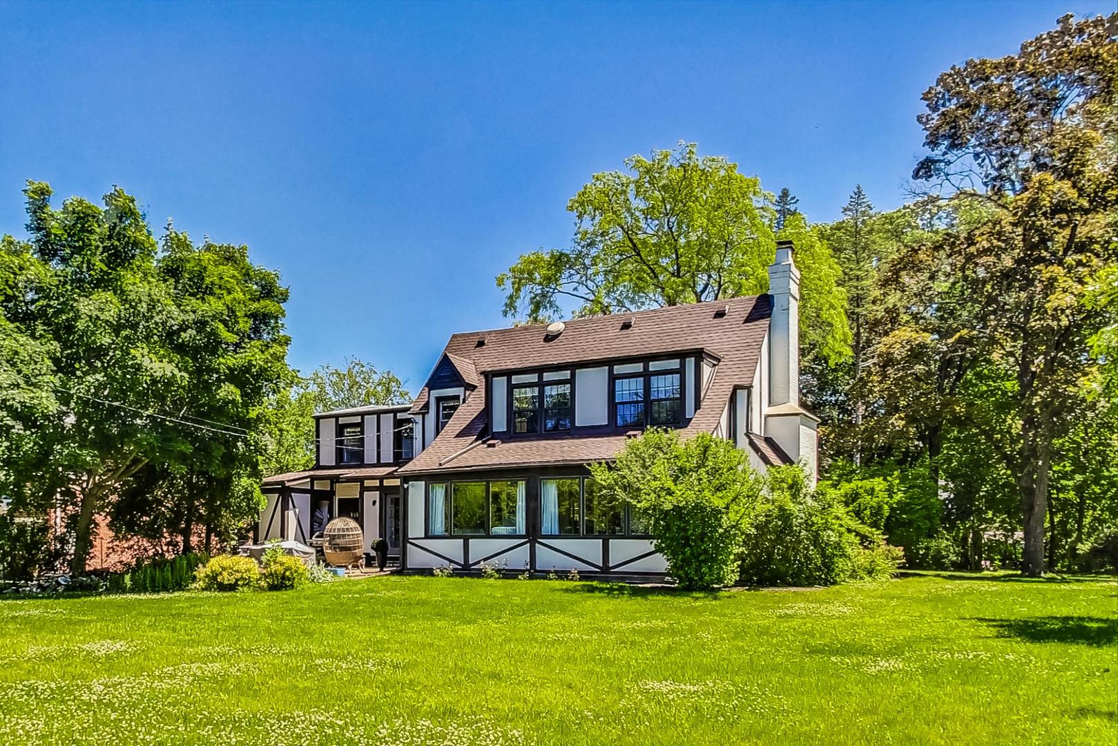 12 Timber Lane Northbrook, IL 60062 - Photo 24 of 28 a view of a house with a big yard and large trees