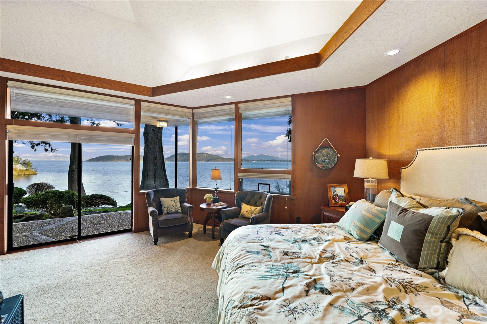 3559 Biz Point Road Anacortes, WA 98221 - Photo 15 of 37 a bedroom with a large bed and large windows