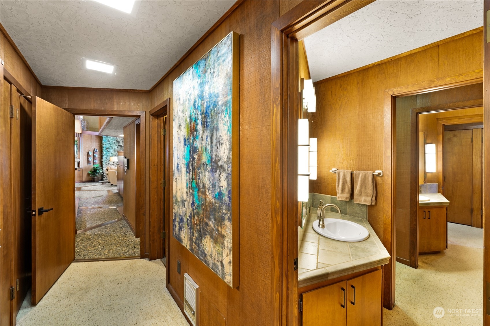 3559 Biz Point Road Anacortes, WA 98221 - Photo 18 of 37 a bathroom with a granite countertop sink mirror vanity and toilet