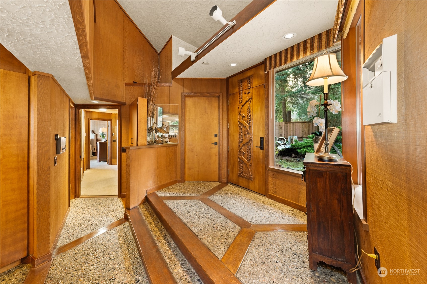 3559 Biz Point Road Anacortes, WA 98221 - Photo 26 of 37 a bedroom with a bed and wooden floor