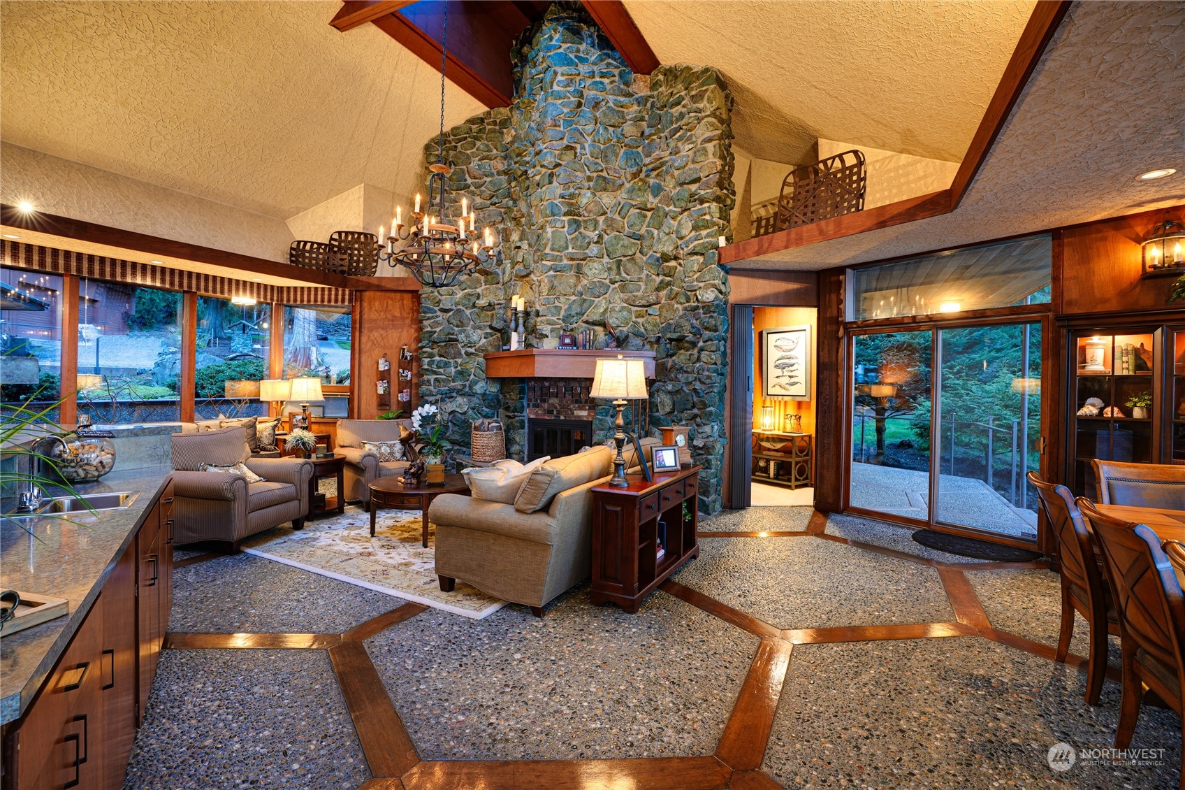 3559 Biz Point Road Anacortes, WA 98221 - Photo 3 of 37 a living room with patio furniture and a fireplace