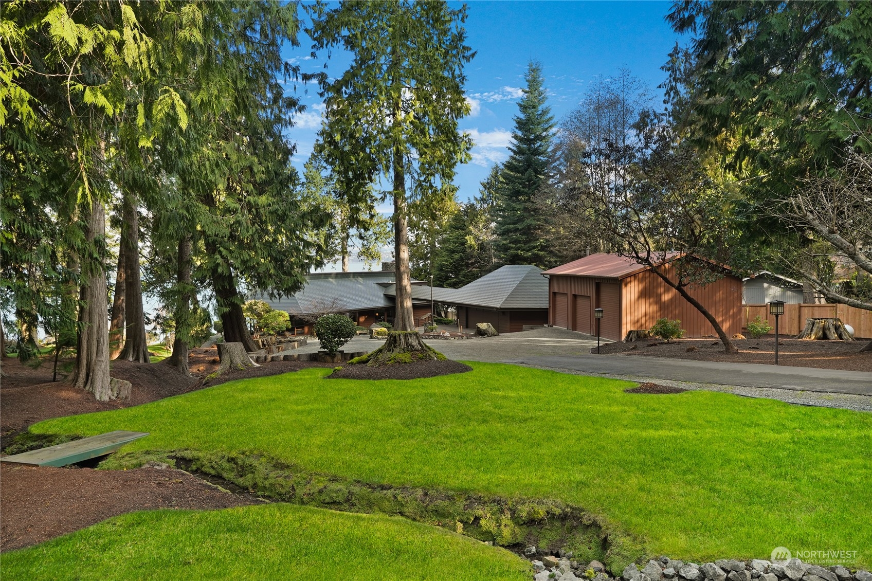 3559 Biz Point Road Anacortes, WA 98221 - Photo 32 of 37 a view of a house with a yard porch and sitting area