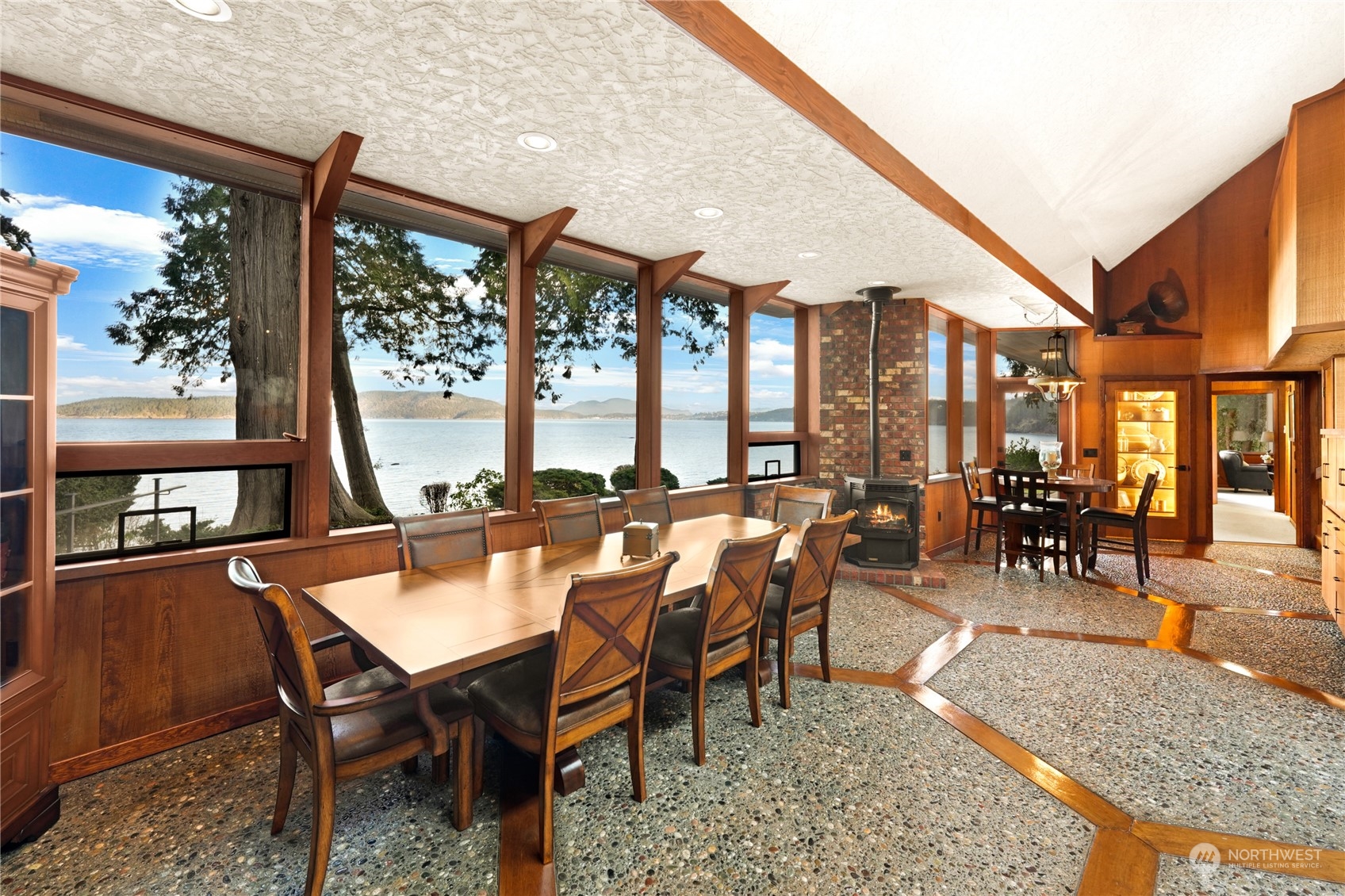 3559 Biz Point Road Anacortes, WA 98221 - Photo 4 of 37 a dining room with furniture a rug and a large window