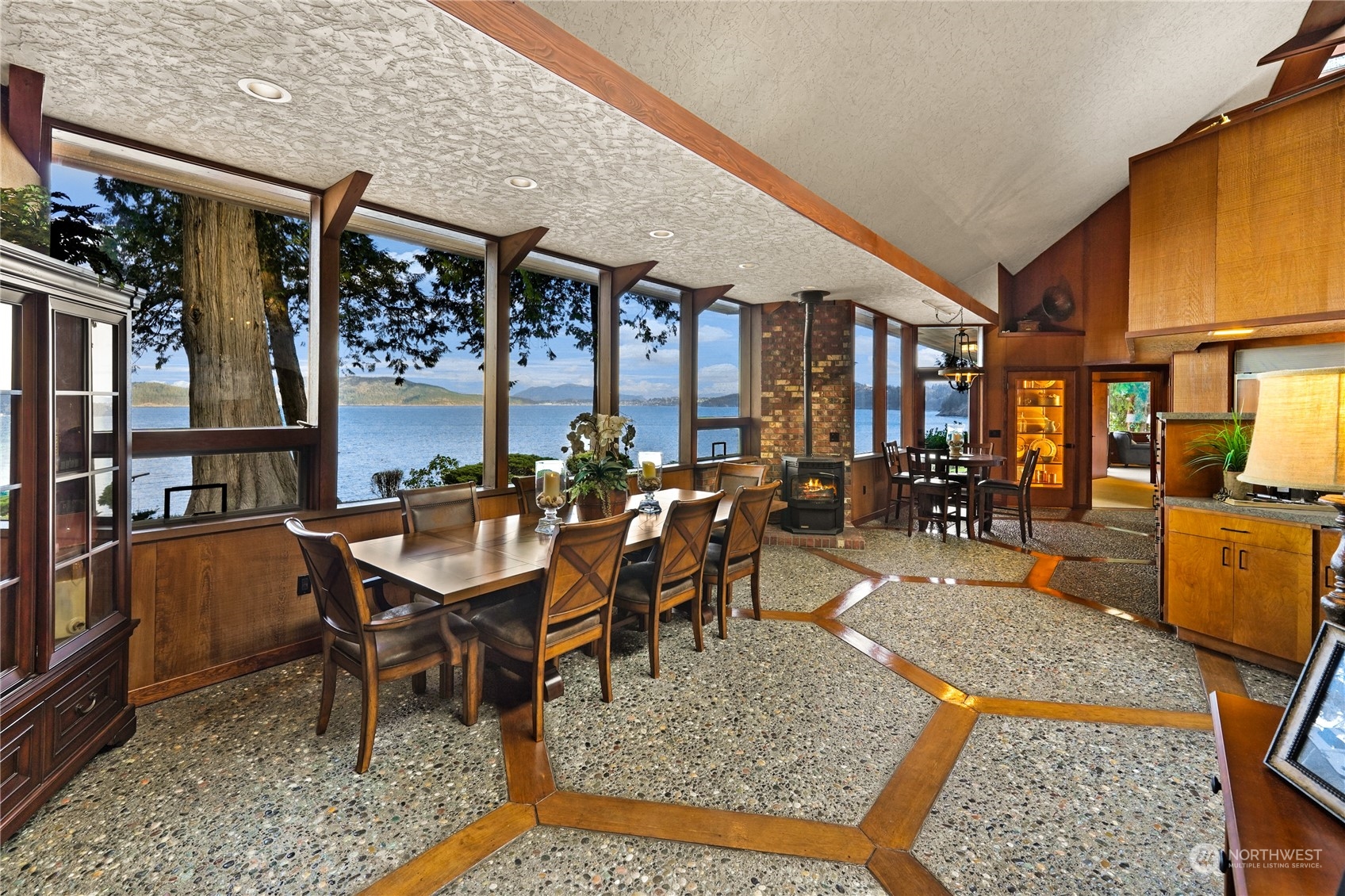 3559 Biz Point Road Anacortes, WA 98221 - Photo 8 of 37 a dining room with stainless steel appliances granite countertop a table and chairs with the wooden floor
